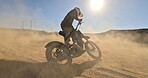 Bike, sand and power with man off road for action, competition or performance on dirt track. Dust, motorcycle and summer with rider on race course for adventure, adrenaline or challenge at training