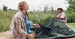 Camping, couple and pitch tent outdoor on holiday, vacation and interracial people travel in nature. Campsite, man and woman setup together, preparation and conversation to help in the countryside