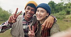 Hiking, selfie and couple hug with peace hands in forest with love, care or bonding adventure in nature together. Portrait, profile picture or people embrace in a jungle for travel, camping or memory