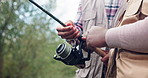 Hands, people and outdoor with fishing rod in nature with teaching, excited or help for catch. Friends, fisherman and together for game, sport or angling for support in countryside, bush or vacation