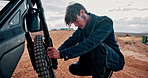 Fix, motorbike and man with mechanic, outdoor and skills with repairs working on springs and transmission. Person, dune and driver with mechanical parts, engineer and transport with timing for safety