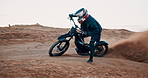 Man, bike and off road for race, action or adventure on sand at cycling rally in desert. Electric bicycle, professional rider or person on dirt for extreme sports, fast or speed for training outdoor