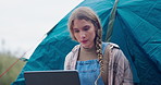 Girl, laptop and camping with tent for research, email or outdoor communication in winter season. Female person, traveler or explorer typing on computer for browsing or search in forest or nature