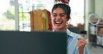 Woman, designer and laptop with fist for success and excited for invitation to international fashion show. Girl, creative person and computer with smile in celebration, profit or winning competition