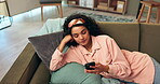 Serious, girl and relax on sofa with smartphone for reading text and feeling annoyed for bad news or disappointment. Woman, home and breathe for calm or frustrated for social media post and message.