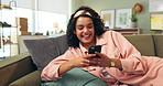 Typing, girl and relax on couch laughing for social media post or meme, funny text and comic content online. Woman, home and smartphone with internet for researching or streaming entertainment videos