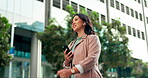 Asian woman, phone call and earphones in city, talking and networking for company deal. Female person, speaking and app for conversation in urban town, travel and consultant for contact on commute