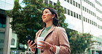 Asian woman, phone and worker for coffee in city, planning and check email for networking. Female person, latte and app for conversation in urban town, website and consultant for contact or commute