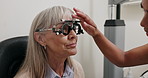 Optometry, vision and woman with trial lens for eye exam, health and wellness in optical store. Ophthalmology, vision and optician with senior female patient with prescription testing in shop.