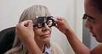 Senior woman, eyes and test by optometrist with phoropter for glasses, frame and vision with insurance. Patient, eye care and exam with tools in optometry for glaucoma or health by specialist