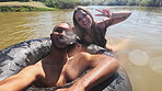 Selfie, swimming and couple in lake in nature live streaming on holiday, vacation and weekend. Peace sign, camping and man and woman on fun adventure for content creation, vlog and travel influencer