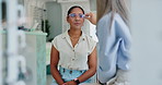 Woman, optometrist and glasses with eye care for sight, vision or checkup at optometry store or shop. Female person or customer talking to optician for optical exam, test or prescription accessory