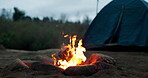 Bonfire, rocks and flames or closeup with camping for bbq, light and travel outdoor in woods for adventure. Campfire, burning fire and charcoal for barbecue, heat and cooking for survival in nature