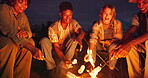 Friends, camping and smores on roast by bonfire with talking, travel adventure and holiday at night. Group, marshmallow and snack with bonding, happy and relax outdoor in nature for vacation or trip