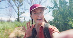 Happy woman, hiking and influencer with nature for vlogging, travel or showing outdoor forest or woods. Portrait of female person or vlogger with smile and waving for tour or trekking in countryside