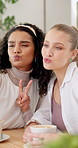 Girl, friends and selfie coffee shop with laugh for pouting lips with peace sign for funny memory. Women, people and happy with kiss, emoji or symbol for profile picture, live stream or vlog in cafe