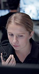 Security guard, woman and radio in control room for talking, communication or report on night watch for safety. Person, agent or worker by computer for surveillance, contact and protection services