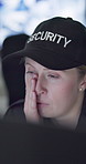 Security, woman and tired in control room with computer for surveillance with burnout, yawning and exhausted. Person, agent or guard with fatigue at pc on night watch for protection services company