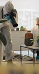 Person, home and forensic photographer for crime scene evidence or burglary, investigation or examination. Hazmat suit, camera and pictures in living room for homicide research, accident or hazard