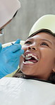 Dentist, hands and girl with tools to check tooth, growth and oral wellness with service in hospital. Child, dental inspection and mouth mirror with help for gum disease, cavity and health in clinic