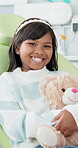 Girl, dentist and smile with teddy, checkup and comfort for oral hygiene and appointment. Child, healthcare and dental care with hugging, gift and orthodontist visit in professional medical clinic