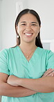 Healthcare, dentist and portrait of Asian woman with arms crossed for dental care, service and pride. Happy, clinic and face of person with smile for oral hygiene, healthy teeth and confidence in job