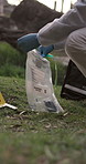 Forensic, evidence and collect with crime scene for investigation in forest with safety bag. Hazmat suit, research and detective with murder case or robbery in mountains with proof for justice 