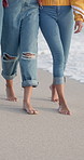 People, friends and legs walking on beach for bonding, travel adventure and relax on holiday together. Feet, sand and group of women on ocean vacation in solidarity, support and weekend fun in nature