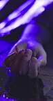 Person, blood and hand of victim on crime scene of homicide, police and investigation for problem solving. Murder, sidewalk and accident or robbery, closeup and detective inspection at night.