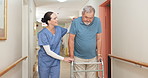 Walking, hospital and nurse with senior man for help, support and care for medical service in clinic. Healthcare, caregiver and worker with patient in hallway for wellness, rehabilitation and nursing