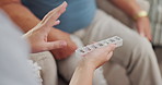 Home, hands and old man with caregiver, pills or healthcare with medication, prescription drugs or treatment for recovery. Pensioner, closeup or nurse with mature patient, tablets or advice with help