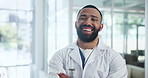 Hospital, doctor and face of man with crossed arms for medical career, service and consulting in clinic. Professional, healthcare and portrait of worker with confidence for wellness, trust and care