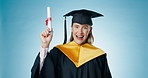 Graduation, face or happy student with certification in studio for college, school or university education. You, portrait or girl graduate pointing for success or goal achievement on blue background