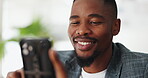 Black man, happy and online on phone in home with digital gaming, internet streaming and entertainment. African person, smartphone and smile with social media scroll, communication or relax in lounge