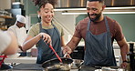 Man, woman or class for gastronomy in kitchen for relationship, bonding with food and happiness. Couple, cooking or learning in restaurant with frying or teamwork, strong connection and communication