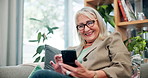 Laugh, phone and senior woman on couch with connection, subscription or online news website in home. Scroll, internet and person on sofa with smartphone, retirement and mobile app chat in living room