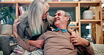 Senior, couple and hugging with smile on sofa in home with embrace, retirement or relax with support. Elderly, people and happy on couch with healthy marriage, bonding and love with care or affection