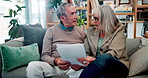 Paperwork, reading and senior couple on sofa with home budget, pension plan or insurance application. Research, man and woman on couch with retirement documents, contract or discussion in living room