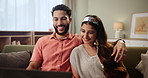 Hug, smile and indian couple watching tv on sofa in living room of home together for subscription entertainment. Happy, love or relax with man and woman streaming movie or video in apartment