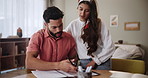Home, couple and table with paper in discussion for finance planning, debt and investment together. Woman, man and documents with communication in house for mortgage, bills and review of budget