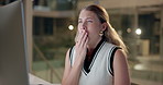 Woman, yawning and tired in night at office with computer, reading and fatigue in overtime. Person, burnout and exhausted by pc with writing, editing and research for job at creative media agency