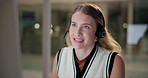 Woman, call center and smile in night with computer, reading and crm for tech support in modern office. Person, agent and consultant for telemarketing, advice and solution with customer care on voip