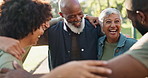 Park, volunteering or happy people in huddle for support, community project or donation in nature for sustainability. Humanitarian, volunteers or senior friends hug with smile, charity service or NGO