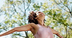 Fitness, happy and woman in park with freedom for training, workout and exercise in nature. Sports, morning and person outdoors with open arms, joy and smile for wellness, healthy body and wellbeing