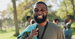 Face, outdoor and man with volunteering, trash bag and smile with sunshine, environment and earth day, Portrait, person and happy guy with recycling, summer or nature with ecology and cleaning a park