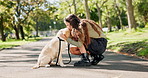 Woman, dog or pet with kiss in street with rubbing, playing and comfort for reward and walking in park. Animal, puppy and embrace in road for companion, bonding and protection in nature with leash