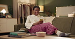 Black girl, text and smartphone on sofa in home scrolling or online social media memes, videos and funny text. Woman, texting and mobile on couch to relax with entertainment, streaming and internet.