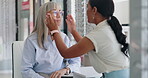 Doctor, patient and help for glasses at shop with assistance, support and option for health care. Women, optometrist and eyewear store with prescription or assessment, consultation and satisfied.