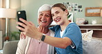 Senior woman, caregiver and selfie in home with smile, hug and photography on sofa in living room. Nurse, elderly person and happy on lounge couch for profile picture, memory or embrace in retirement