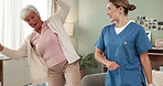 Happy, senior woman and nurse in home for dancing, entertainment and moving while laughing. House, elderly person and caregiver in living room for good news, recreation and performance in lounge